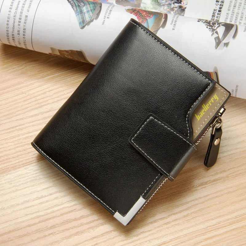 Black leather Baellerry wallet with metal corner and zip on wooden surface with magazine