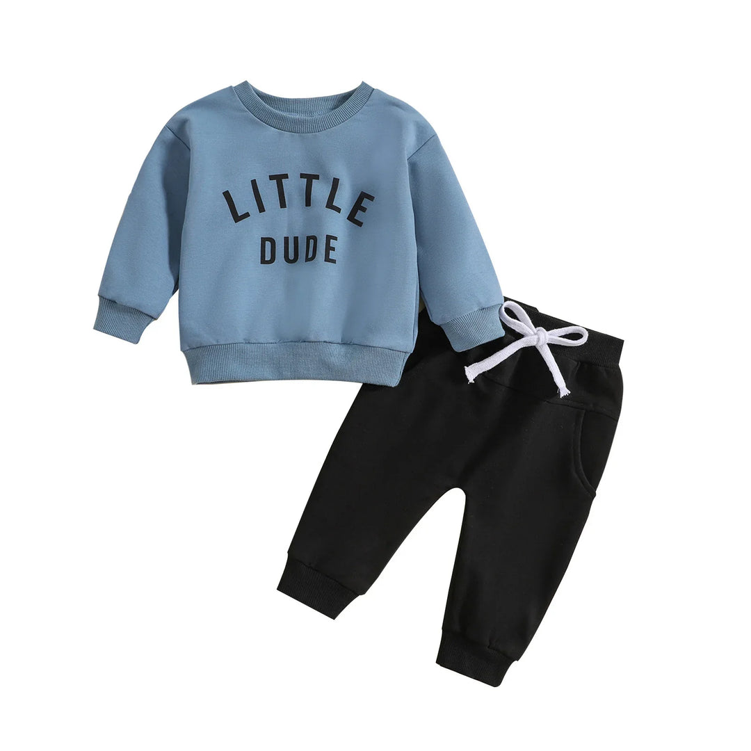 Toddler outfit with light blue sweatshirt reading Little Dude and black pants with white drawstring