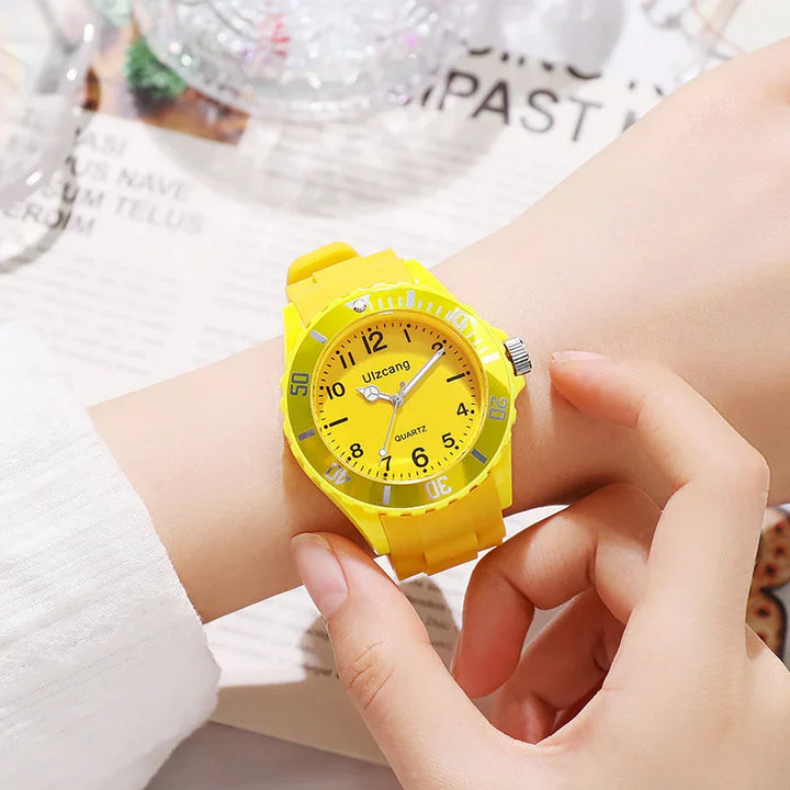 Close-up of a person adjusting a bright yellow Uzcang quartz wristwatch on their arm