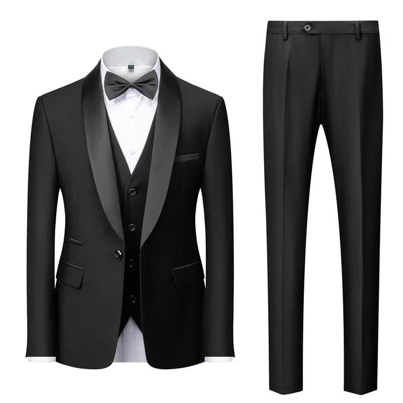Black tuxedo suit with satin lapel, white dress shirt, black bow tie, vest, and matching black pants