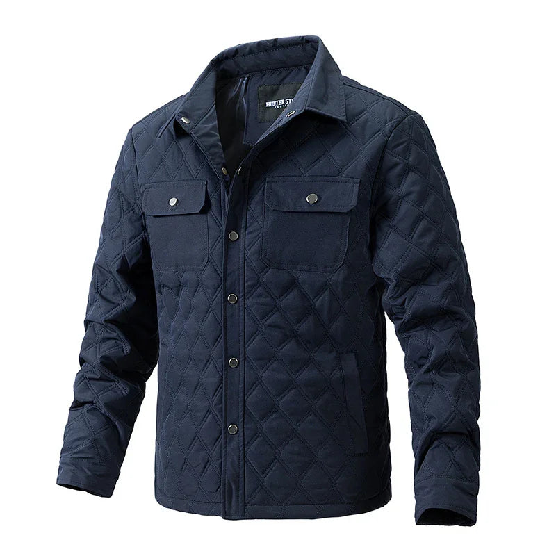 Men's navy blue quilted jacket with snap button pockets and collar
