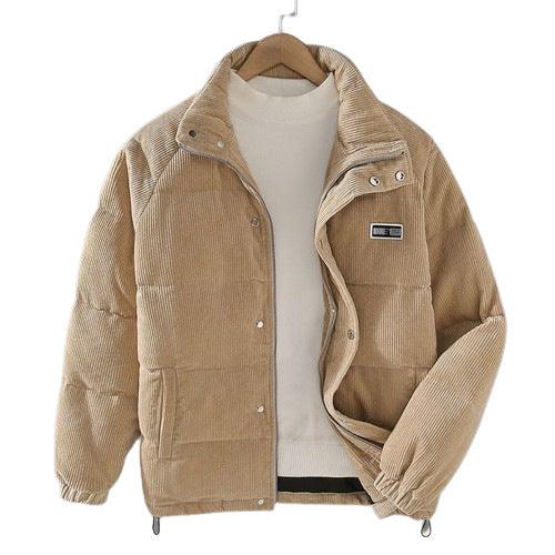 Beige corduroy puffer jacket with snap buttons over white sweater on wooden hanger