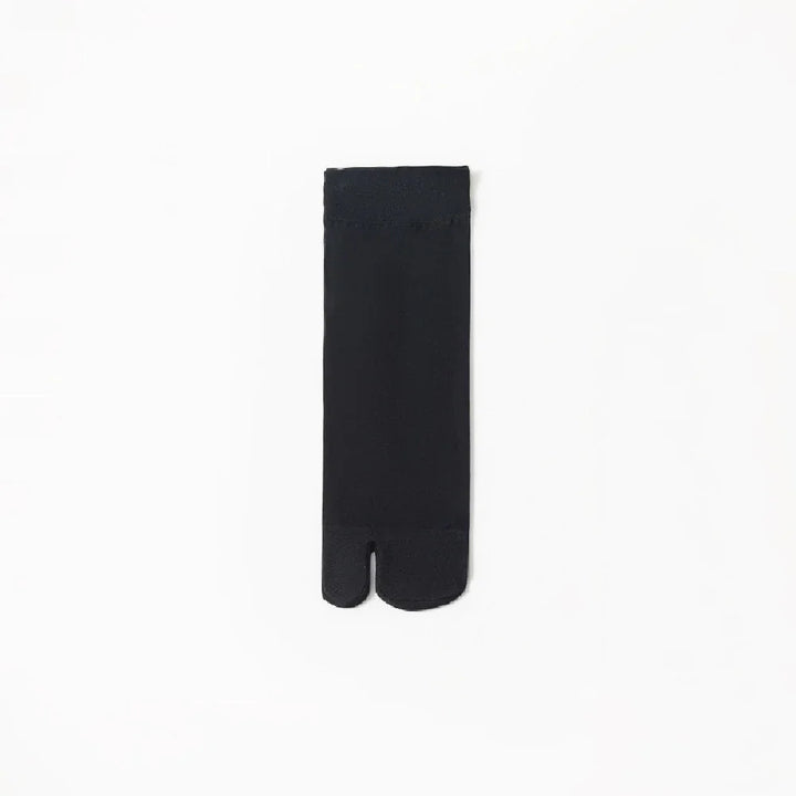 Black split-toe sock laid flat on white background, minimalist fashion accessory
