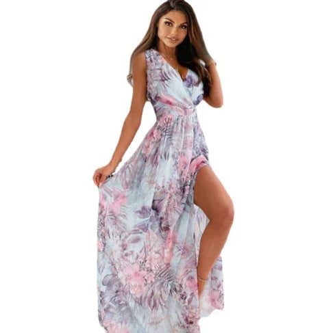 Woman wearing a sleeveless floral maxi dress with a deep V-neck and thigh-high slit