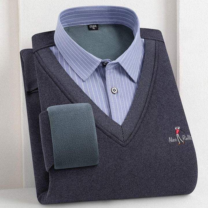Folded men's navy blue V-neck sweater with embroidered golfer and light blue striped collared shirt