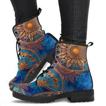 Blue lace-up ankle boots with orange and gold mandala designs, worn with black pants