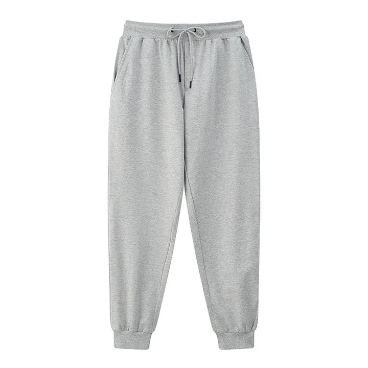 Light grey casual sweatpants with elastic waistband, drawstring, side pockets, and cuffed ankles