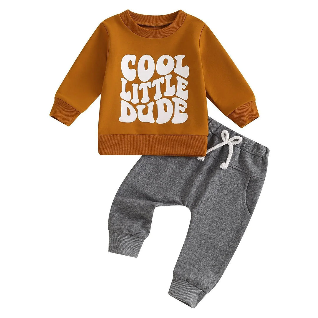 Toddler outfit with mustard sweatshirt reading 'Cool Little Dude' and grey sweatpants with drawstring