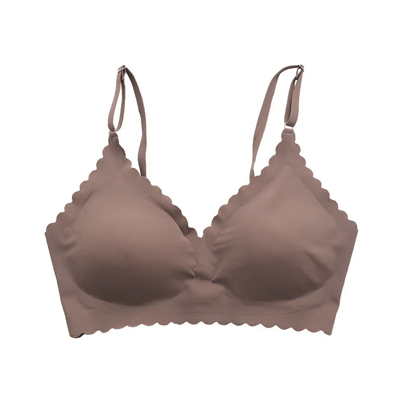 Seamless brown wireless bra with scalloped edges and adjustable straps on white background