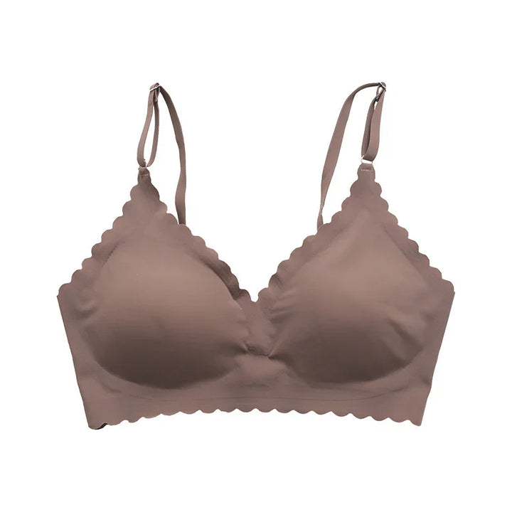 Seamless brown wireless bra with scalloped edges and adjustable straps on white background