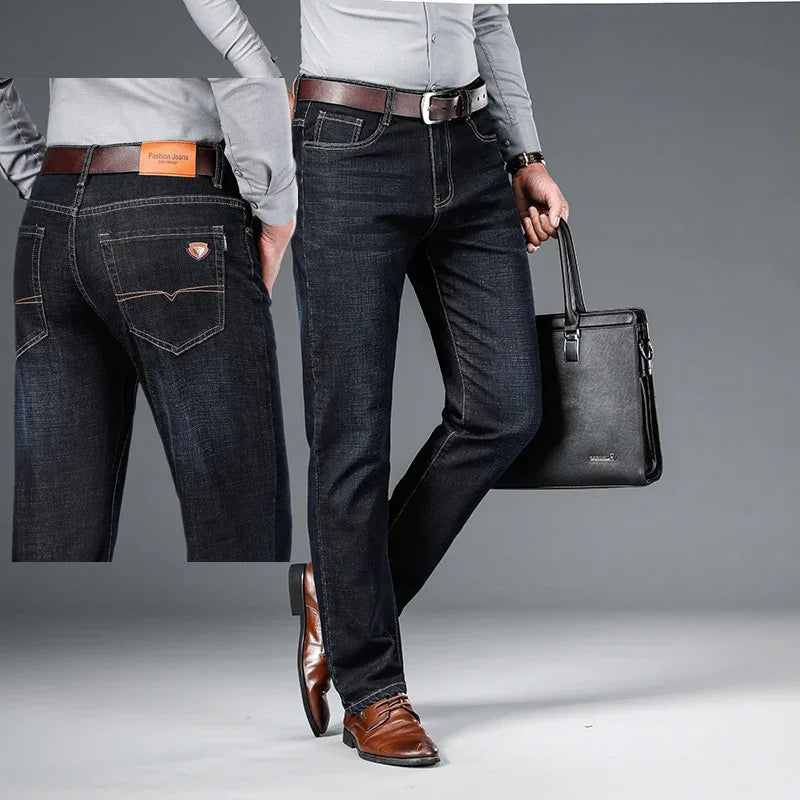 Men's dark blue denim jeans with brown belt, brown leather shoes, and black leather briefcase
