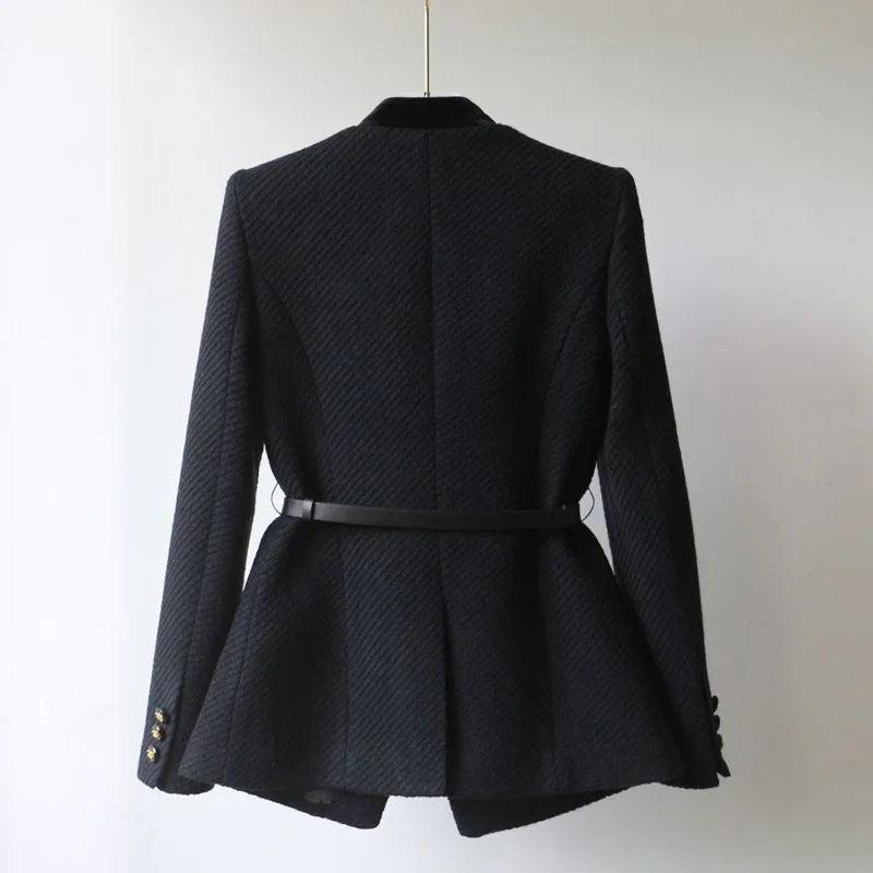 Back view of black textured blazer with fitted waist and gold buttons on sleeves
