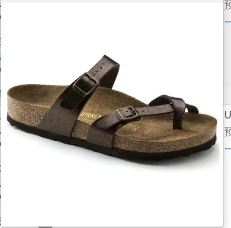 Brown leather Birkenstock sandal with adjustable buckle straps and cork footbed on white background