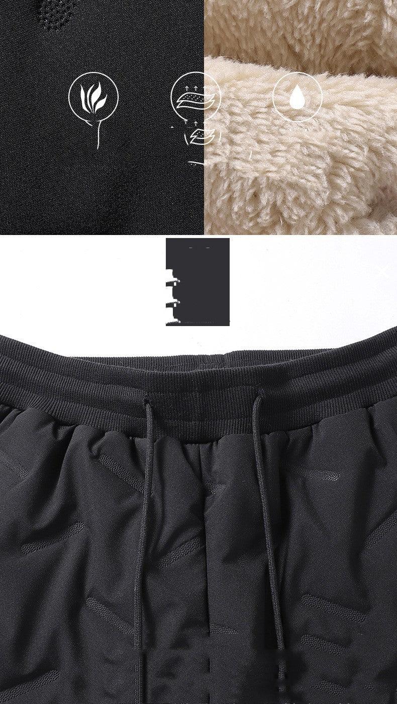 Black athletic shorts with ribbed waistband and drawstrings, soft fleece lining, and moisture-wicking fabric icons