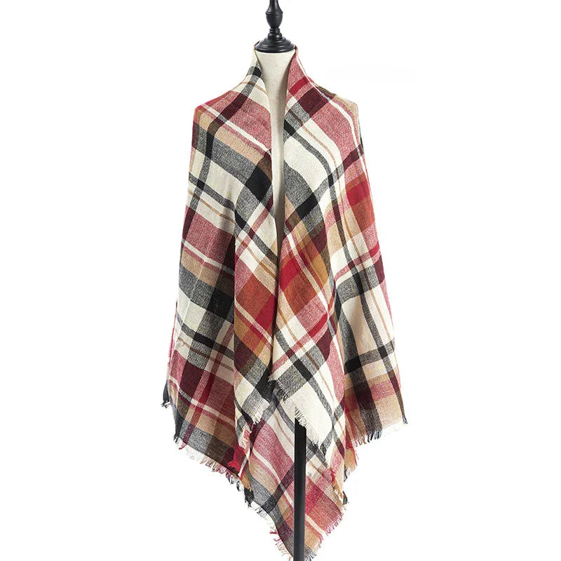 Plaid blanket scarf with red, black, beige, and mustard stripes on mannequin