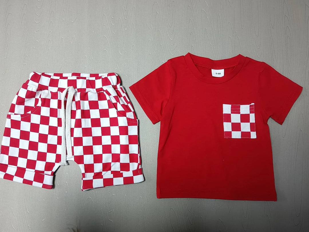 Red baby t-shirt with checkered red and white pocket and matching checkered shorts laid flat