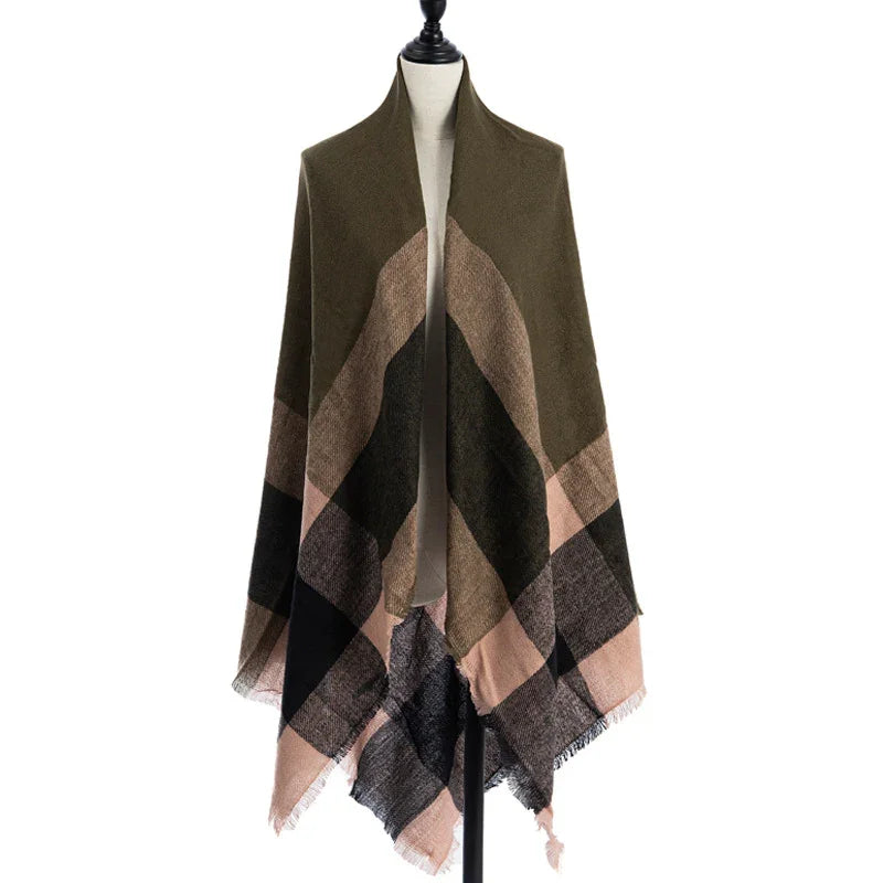 Plaid knit shawl with olive, beige, black, and pink color blocks displayed on mannequin