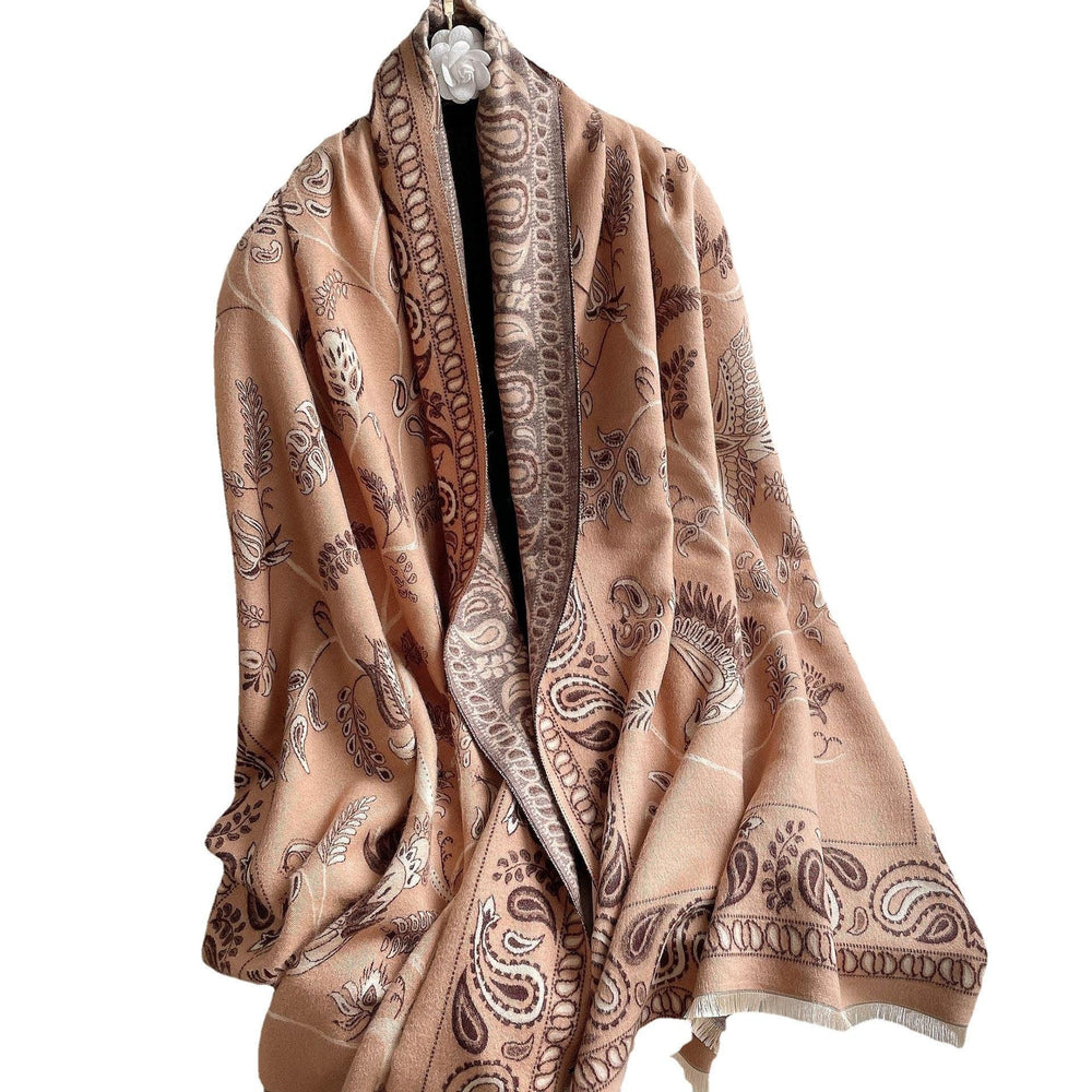 Soft beige and brown paisley patterned shawl draped elegantly with floral and leaf motifs