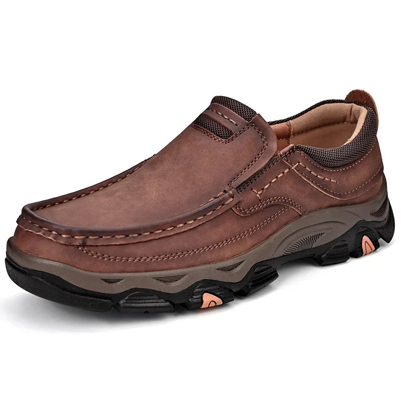 Brown slip-on leather casual men's shoe with stitched detailing and rugged rubber sole