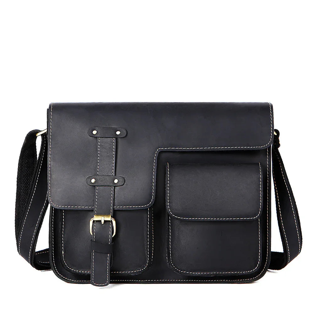 Black leather messenger bag with front pockets, buckle strap, and adjustable shoulder strap