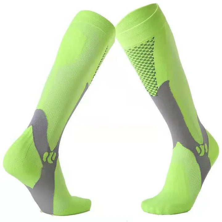 Pair of neon green and gray knee-high compression socks with support padding