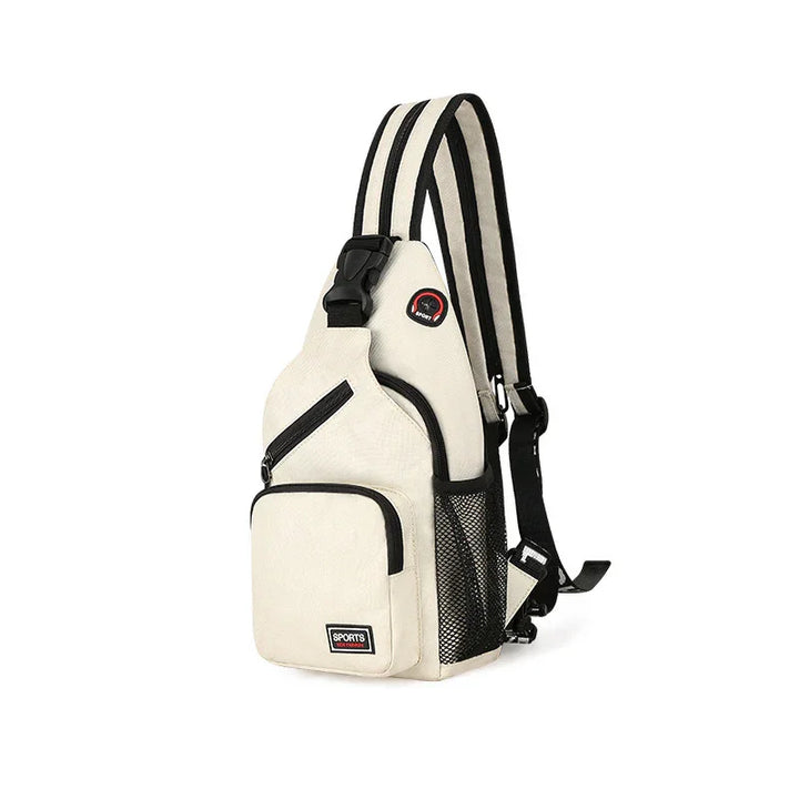 Beige sports sling backpack with black trim, multiple zippered pockets, and striped shoulder strap