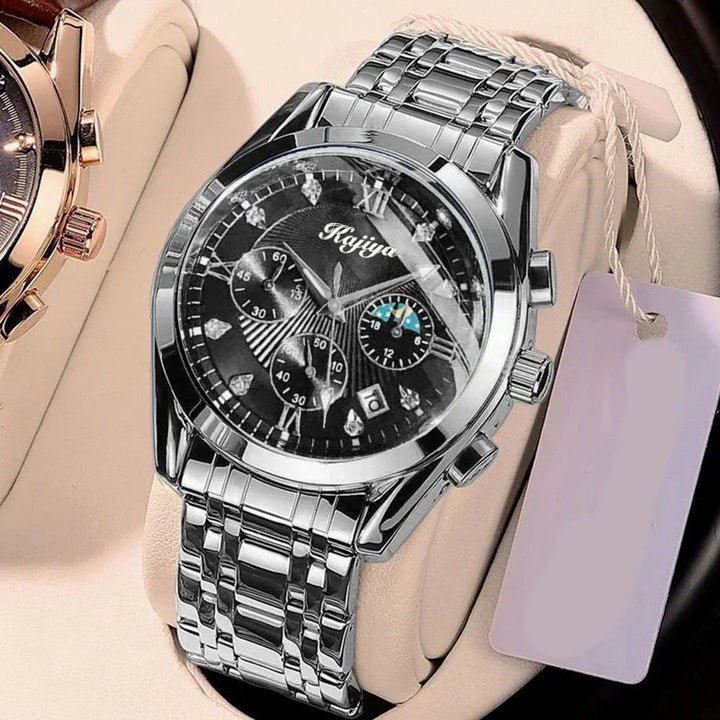 Silver metal wristwatch with black dial, multiple subdials, and date display on beige cushion