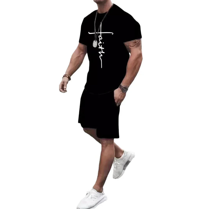 Man wearing black faith graphic t-shirt and matching black shorts with white sneakers