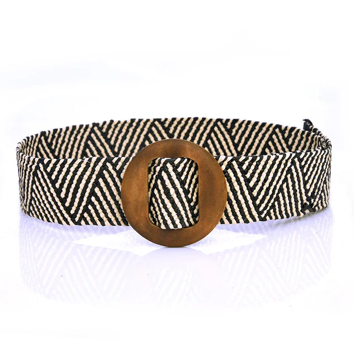 Black and white woven belt with geometric pattern and large round bronze buckle