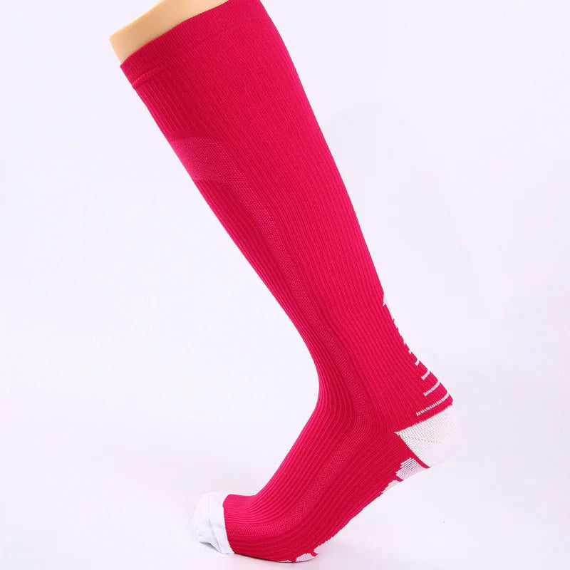 Red knee-high athletic sock with white toe and heel on a mannequin leg