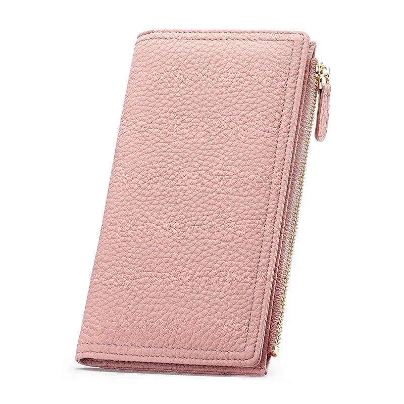 Pink textured leather wallet with gold zipper on white background