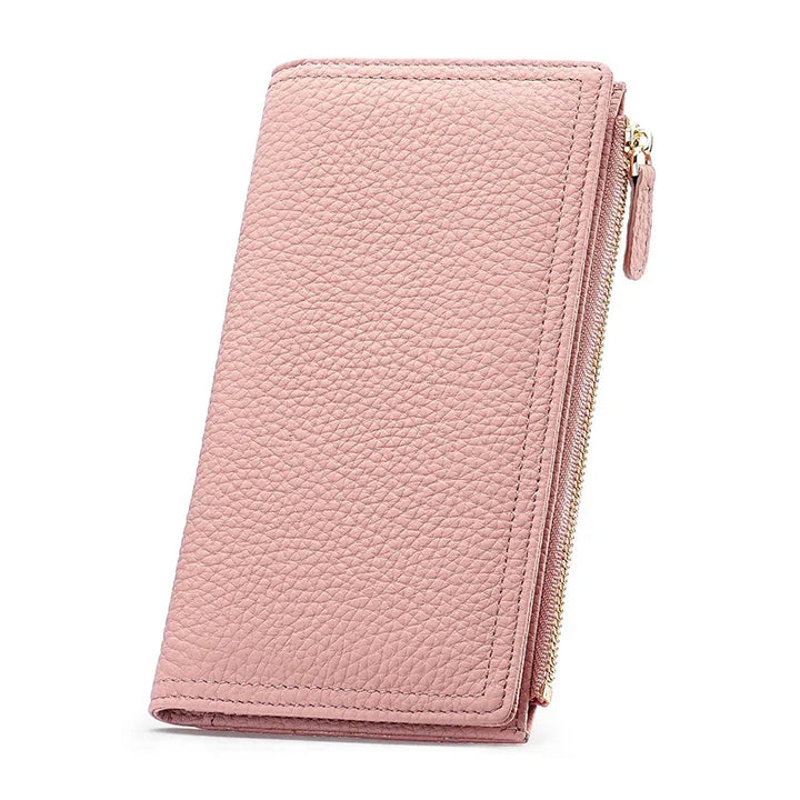 Pink textured leather wallet with gold zipper on white background