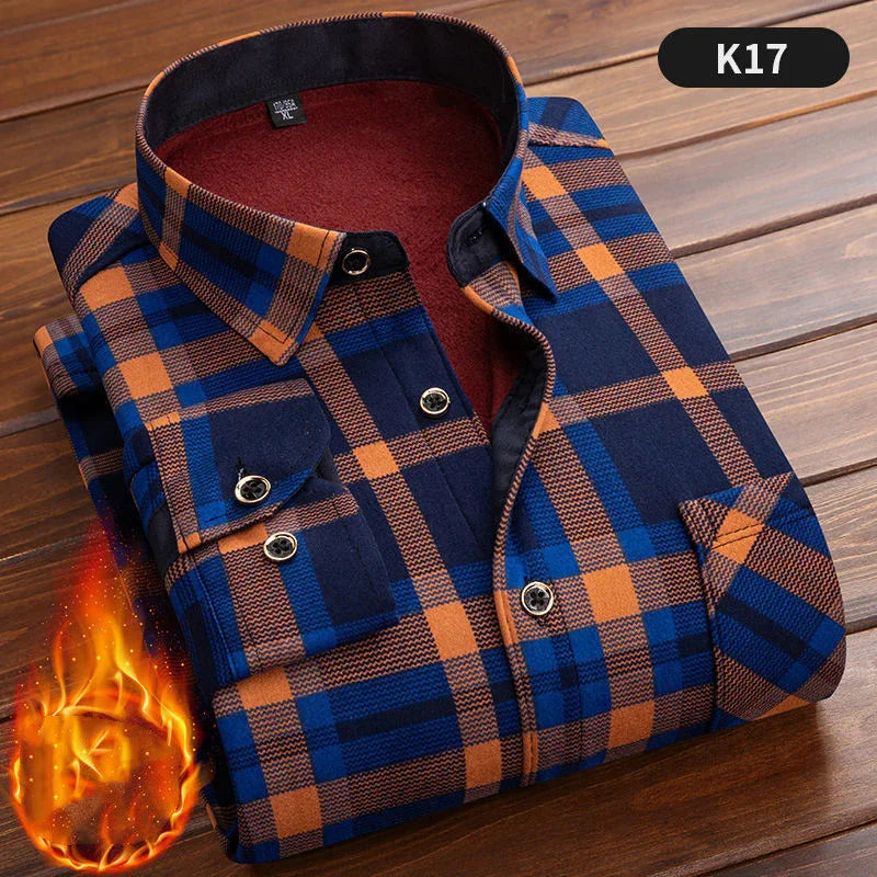 Folded blue and orange plaid flannel shirt with black buttons on wood surface, warm fabric