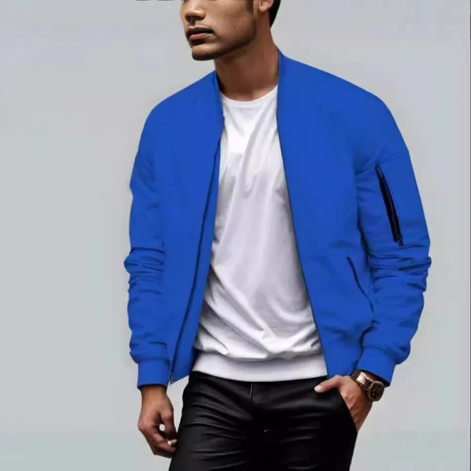 Man wearing a stylish blue bomber jacket with a white t-shirt and black pants, casual fashion