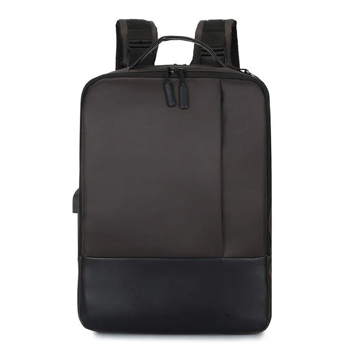 Sleek black rectangular backpack with padded straps and dual zipper closure on white background