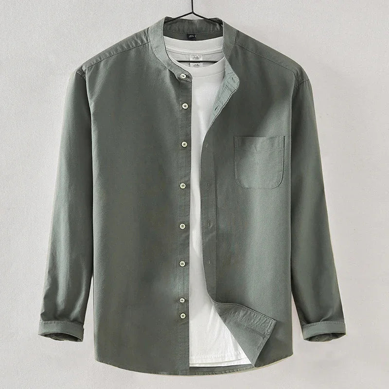 Green long-sleeve button-up shirt layered over white crew neck t-shirt on hanger