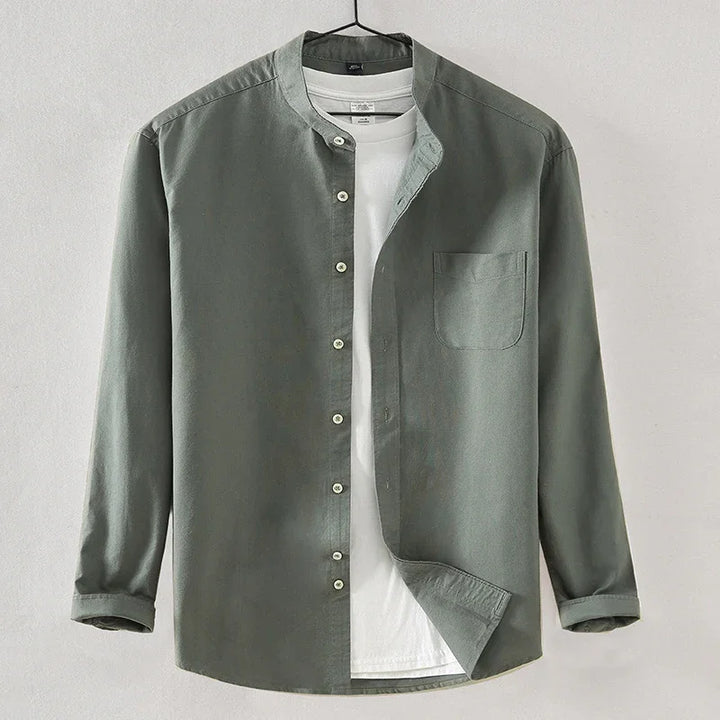 Green long-sleeve button-up shirt layered over white crew neck t-shirt on hanger