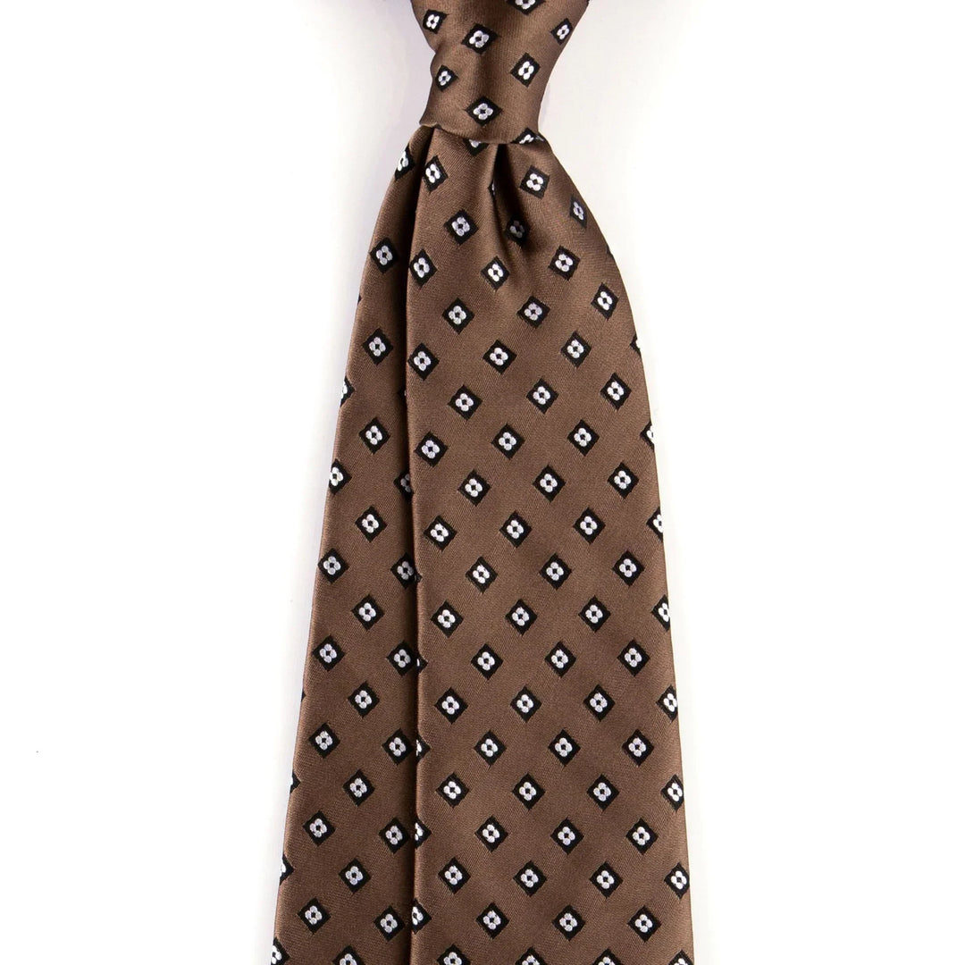 Brown silk tie with repeating white and black diamond pattern on plain background