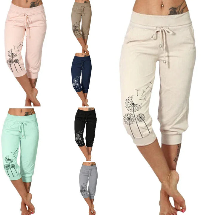 Women's casual cropped pants with drawstring and dandelion print in multiple colors including beige, navy, black, mint, and gray