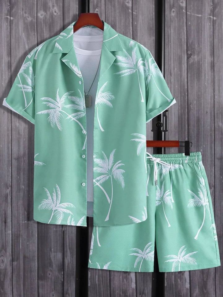 Mint green Hawaiian shirt and shorts set with white palm tree print on wooden background