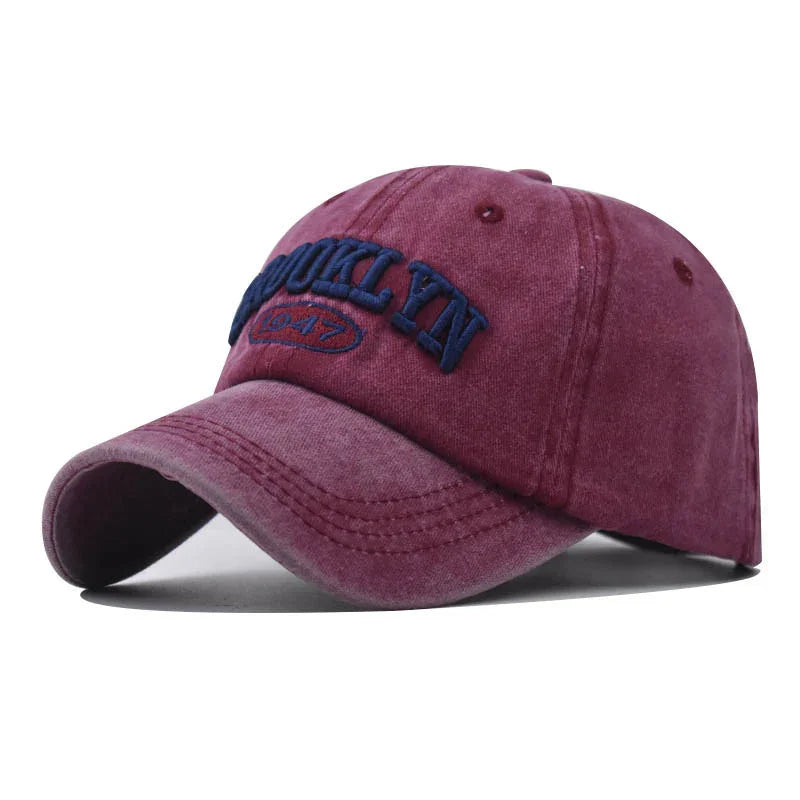 Burgundy vintage-style baseball cap with navy blue embroidered Brooklyn 1947 text