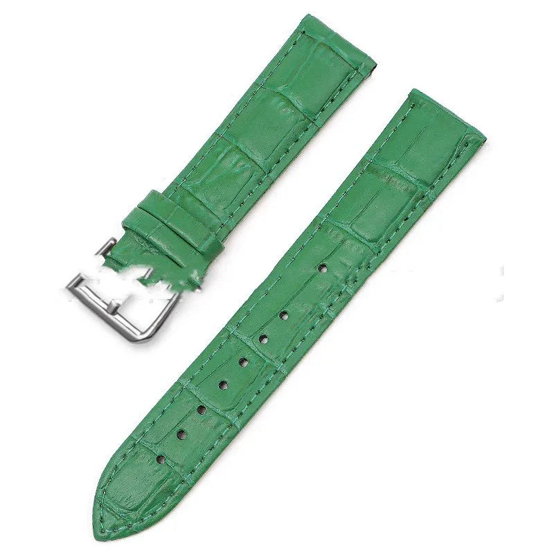 Green leather watch strap with crocodile pattern and silver buckle on white background