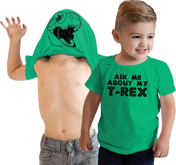 Two young boys wearing green T-Rex themed shirts, one with T-Rex print on hood, the other with text print