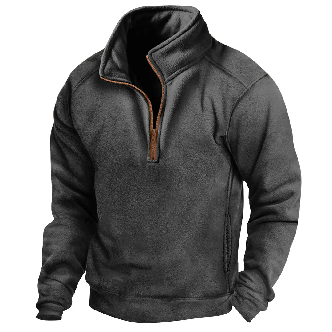 Black fleece pullover with half-zip and brown zipper on white background