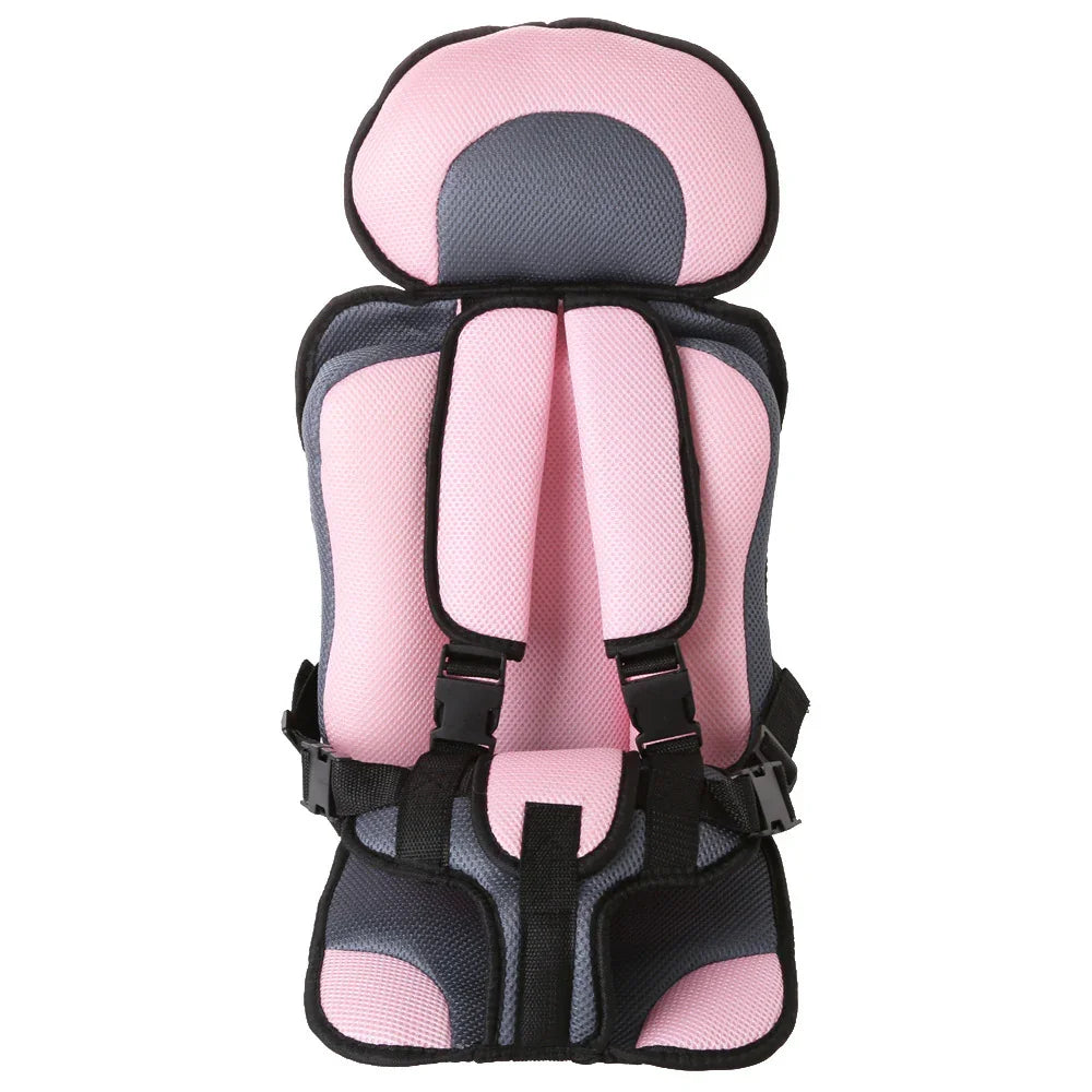 Pink and gray padded child safety car seat with adjustable harness straps