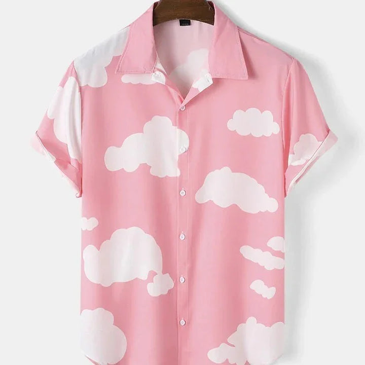 Pink short-sleeve button-up shirt with white cloud pattern on wooden hanger