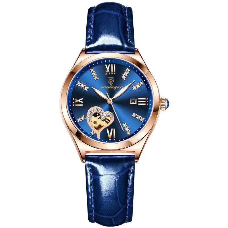 Luxury blue wristwatch with rose gold case, heart-shaped skeleton dial, and diamond hour markers