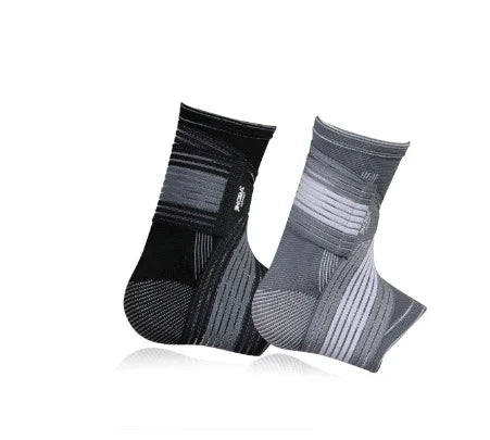 Two compression ankle socks, one black and one gray, with striped patterns on white background