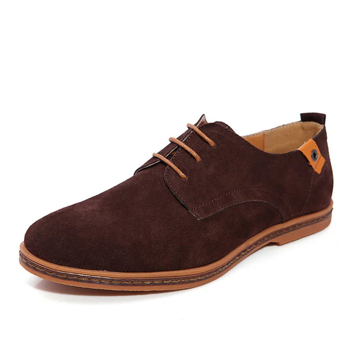 Brown suede casual men's lace-up shoe with tan sole and small orange accent on heel