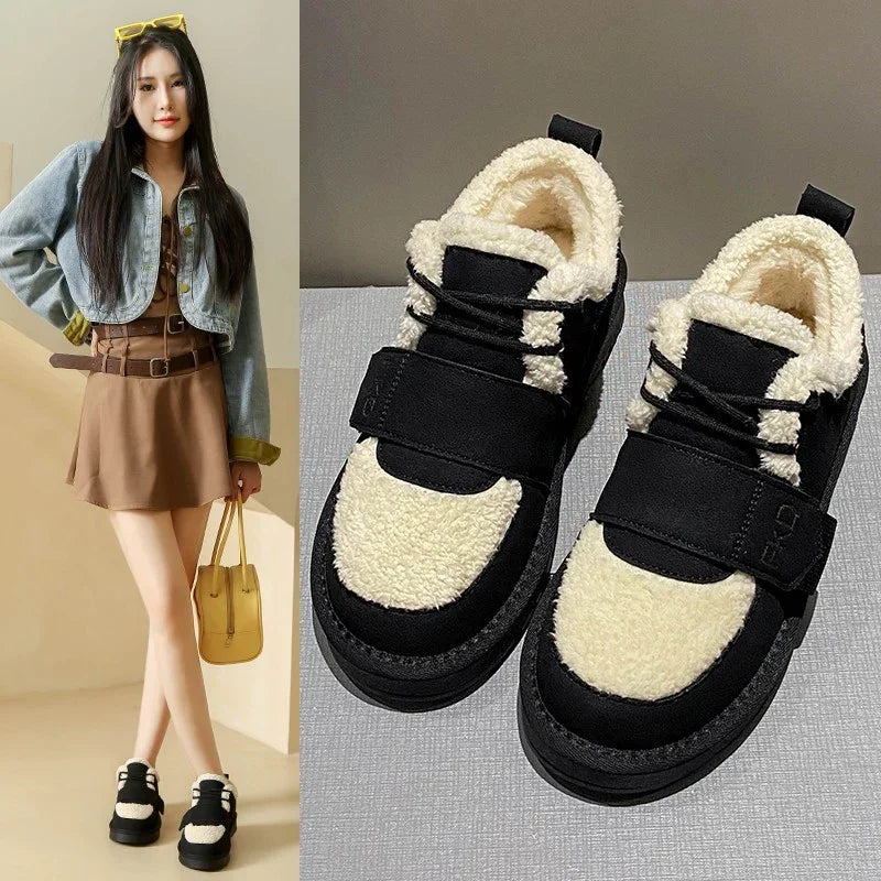 Women's black and white shearling sneakers paired with brown dress and cropped denim jacket outfit
